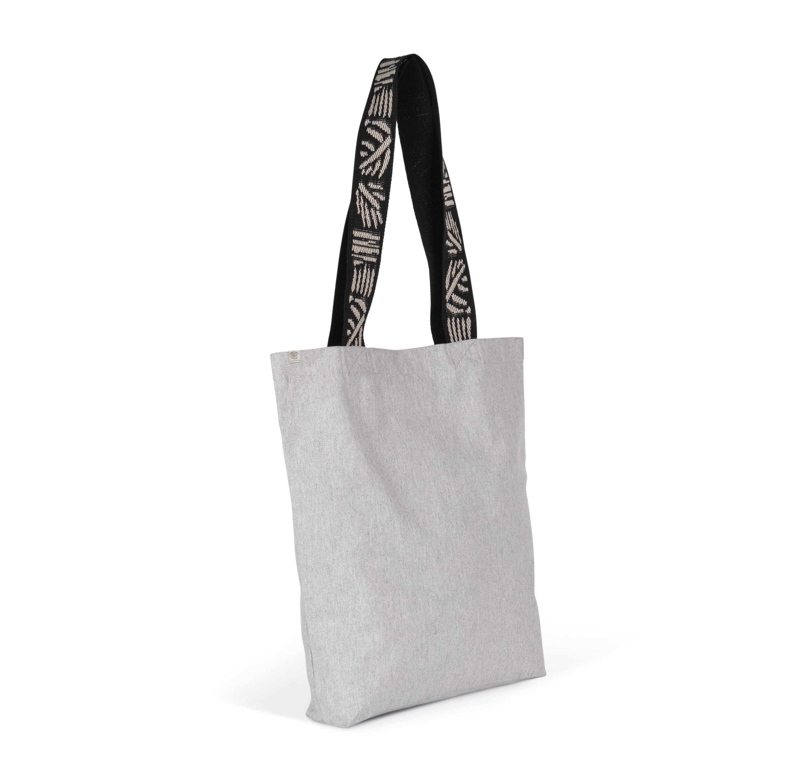 Sac tote bag en tissu gris clair avec poignées noires à motifs, prêt à personnaliser pour vos événements. commentaire: comment choisir un tote bag