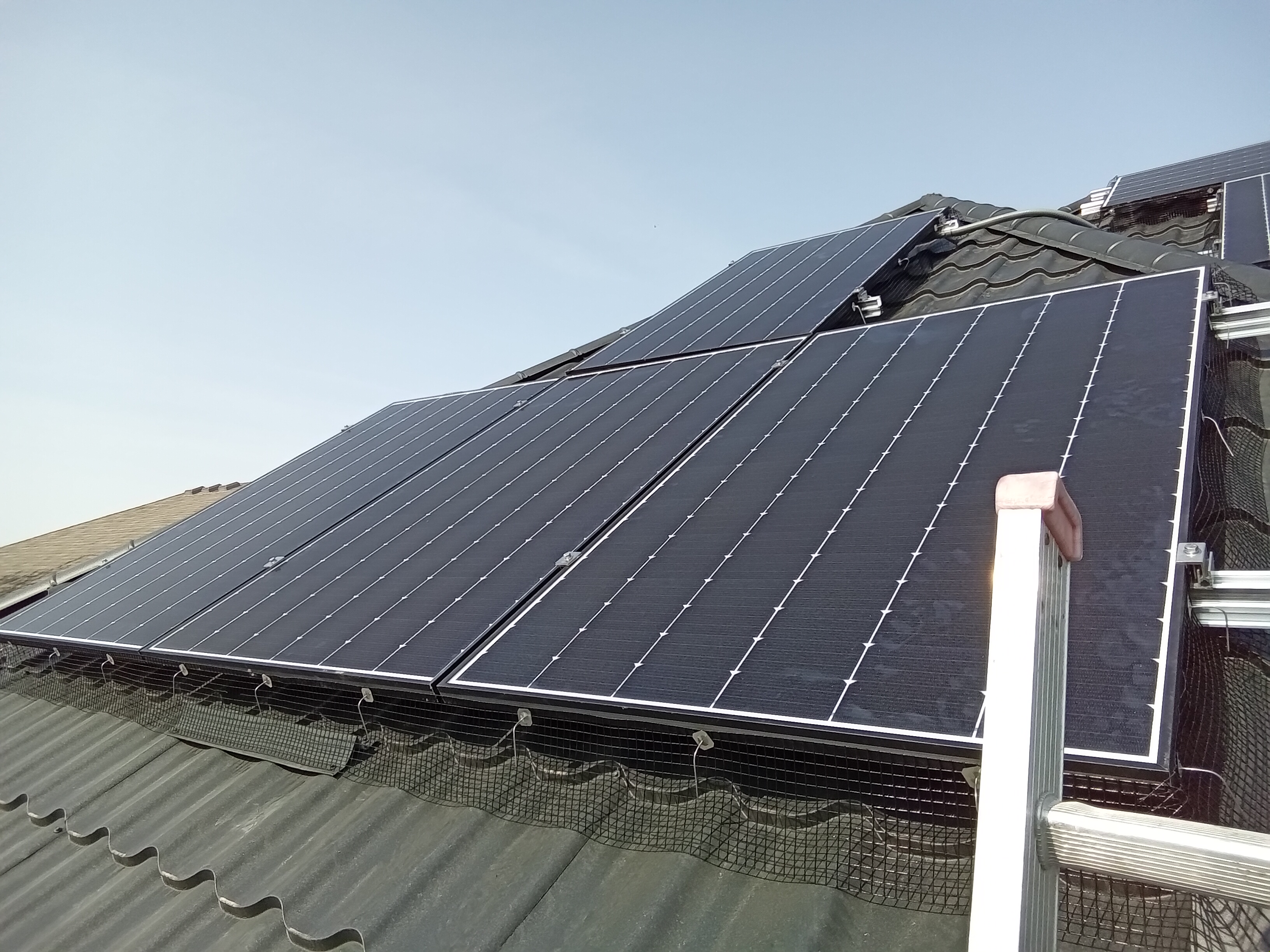 Solar panels installed on a sloped rooftop.