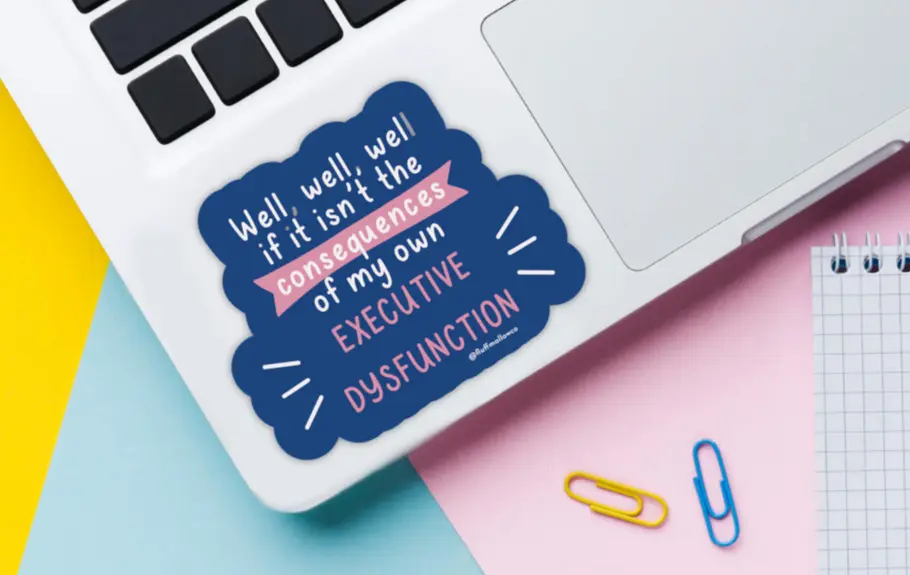 Sticker on a laptop with the quote: “Well, well, well if it isn’t the consequences of my own EXECUTIVE DYSFUNCTION.”
