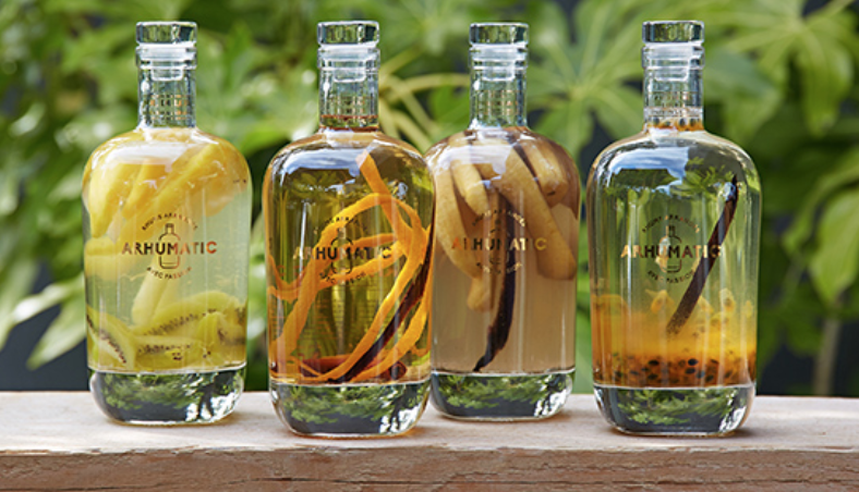 Quatre bouteilles de rhum arrangé Arhumatic aux fruits exotiques, disponibles sur Boutique-rhum.com
