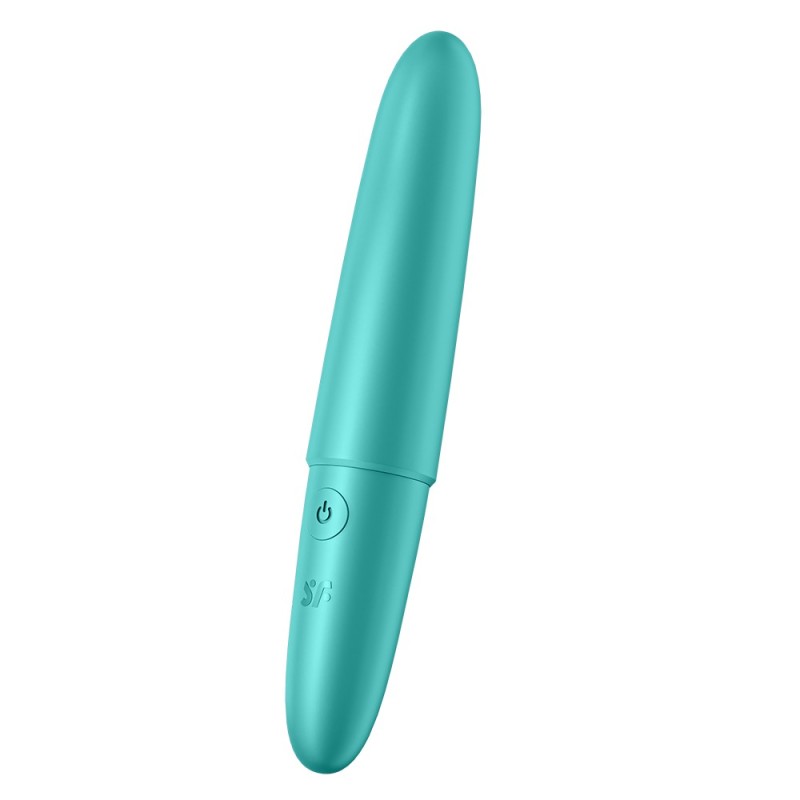 Stimulateur ou vibromasseur turquoise posé verticalement avec bouton d’alimentation visible.