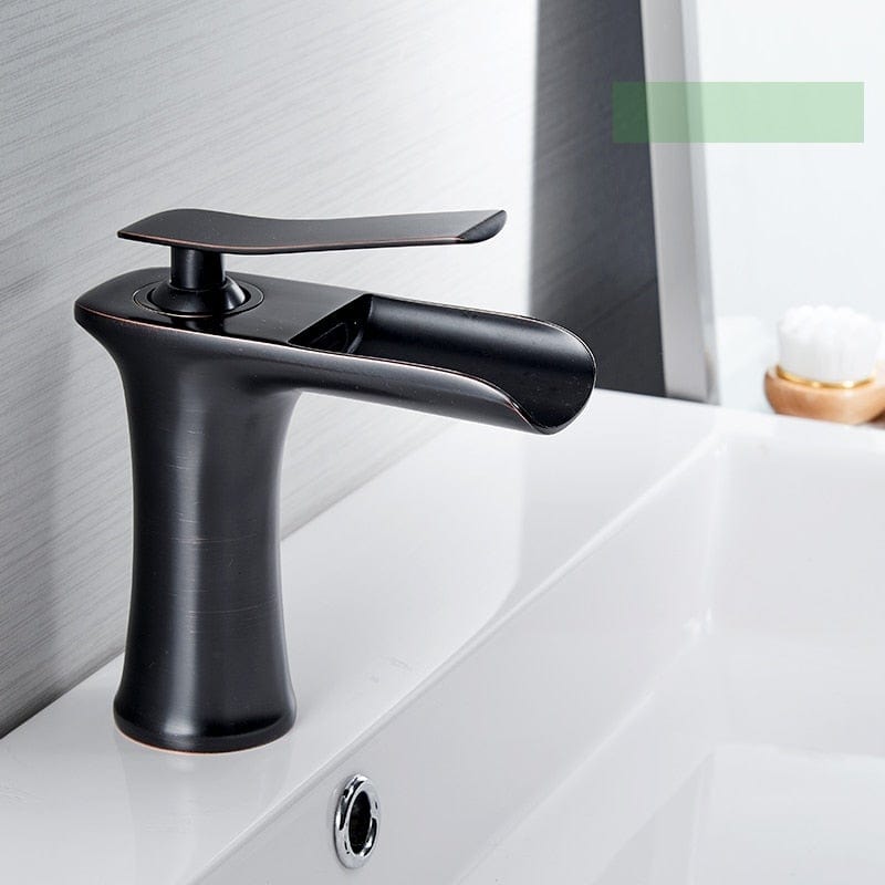 Modern black faucet on white sink; mirror and sleek small accessory in background, bright bathroom ambiance. How to light an entrance with integrated lighting? [Note: the keyword requested is to integrate "comment éclairer une entrée luminaire" naturally; however image shows bathroom faucet; ensure ALT describes image and includes keyword naturally if possible but avoid forced. I'll include a natural mention:] Designer black faucet in a contemporary bathroom, soft and minimalist lighting. how to light an entrance with a fixture.